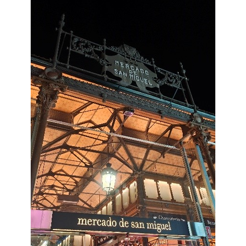 A building with a sign on the side

Description automatically generated